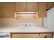 Kitchen sink and countertops with light wood cabinets at 224 Sky Loch E Dr, Dunedin, FL 34698
