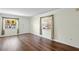 Living room with wood floors and neutral walls at 224 Sky Loch E Dr, Dunedin, FL 34698