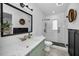 Modern bathroom with a frameless shower and marble vanity at 2705 Lakeville Dr, Tampa, FL 33618