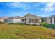 Landscaped backyard with patio and view of house at 2852 Banyan Hill Ln, Land O Lakes, FL 34639