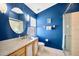 Bathroom with blue walls, shower, and vanity at 2852 Banyan Hill Ln, Land O Lakes, FL 34639