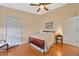 Bedroom with wood flooring and a double bed at 2852 Banyan Hill Ln, Land O Lakes, FL 34639