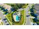 Aerial view of community pool with surrounding lounge chairs at 2852 Banyan Hill Ln, Land O Lakes, FL 34639