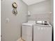 Laundry room with washer, dryer, and shelving at 2852 Banyan Hill Ln, Land O Lakes, FL 34639