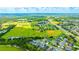Aerial view of community sports fields and surrounding area at 2852 Banyan Hill Ln, Land O Lakes, FL 34639