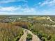 Aerial view of community and surrounding landscape at 30129 Mossbank Dr, Wesley Chapel, FL 33543