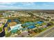 Aerial view showcasing community, pool, and sports facilities at 30129 Mossbank Dr, Wesley Chapel, FL 33543