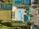 Community pool, tennis courts, playground, and parking at 30129 Mossbank Dr, Wesley Chapel, FL 33543