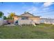 Large backyard with patio, playset, and partial home view at 3436 51St N Ave, St Petersburg, FL 33714