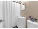 Clean bathroom with a shower/tub combo, white vanity, and toilet at 3436 51St N Ave, St Petersburg, FL 33714