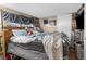 Main bedroom with unmade bed and various items at 3436 51St N Ave, St Petersburg, FL 33714