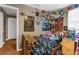 Small bedroom with wooden bed frame and posters on the wall at 3436 51St N Ave, St Petersburg, FL 33714