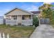 Charming yellow house with a porch and a small yard at 3436 51St N Ave, St Petersburg, FL 33714
