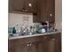 Kitchen with dark brown cabinets and a double sink at 3436 51St N Ave, St Petersburg, FL 33714