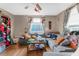 Living room with a sectional sofa and hardwood floors at 3436 51St N Ave, St Petersburg, FL 33714
