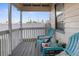 Covered porch with teal chairs and small table at 3436 51St N Ave, St Petersburg, FL 33714