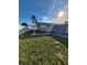 Large backyard with grassy area and walkway at 3445 Bedford St, Holiday, FL 34690