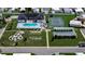 Community overview showing pool, tennis court, and clubhouse at 35216 Dodie Dr, Zephyrhills, FL 33541