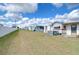 Spacious backyard with grassy area and mobile homes at 35216 Dodie Dr, Zephyrhills, FL 33541