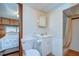 Clean bathroom with a toilet, sink, and shower at 35216 Dodie Dr, Zephyrhills, FL 33541