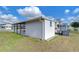 Side view of house and yard at 35216 Dodie Dr, Zephyrhills, FL 33541