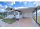 Front view of the house with carport at 35216 Dodie Dr, Zephyrhills, FL 33541