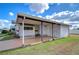 Side view of the house with carport at 35216 Dodie Dr, Zephyrhills, FL 33541