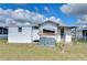 Rear view of house and AC unit at 35216 Dodie Dr, Zephyrhills, FL 33541