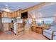 Small kitchen with white appliances and wood cabinets at 35216 Dodie Dr, Zephyrhills, FL 33541