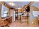 Open concept kitchen with dining area and wood cabinets at 35216 Dodie Dr, Zephyrhills, FL 33541