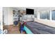 Small bedroom with a bed, TV, and fish tank at 4734 15Th S Ave, St Petersburg, FL 33711