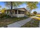 1-story home with a porch and landscaping at 4734 15Th S Ave, St Petersburg, FL 33711