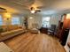 Bright living room featuring hardwood floors and ample seating at 7 Desoto E St, Bradenton, FL 34208