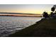 Scenic sunset over calm water with a long pier at 7 Desoto E St, Bradenton, FL 34208