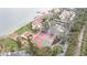 Aerial view of waterfront community with tennis courts and kayak storage at 7540 Sunshine Skyway S Ln # 220, St Petersburg, FL 33711