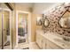 Bathroom with double vanity and patterned tile at 7540 Sunshine Skyway S Ln # 220, St Petersburg, FL 33711