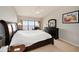 This comfortable bedroom features water views and neutral carpet at 7540 Sunshine Skyway S Ln # 220, St Petersburg, FL 33711