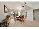 Charming dining area with chandelier and patio access at 7540 Sunshine Skyway S Ln # 220, St Petersburg, FL 33711