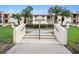 Well-maintained condo building, inviting walkway at 7540 Sunshine Skyway S Ln # 220, St Petersburg, FL 33711