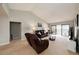 This comfortable living room features a vaulted ceiling and access to the balcony at 7540 Sunshine Skyway S Ln # 220, St Petersburg, FL 33711