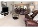 Bright living room, leather furniture, fireplace at 7540 Sunshine Skyway S Ln # 220, St Petersburg, FL 33711
