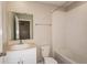 Bathroom with single vanity, tub, and tile surround at 7639 Peace Lily Ave, Wesley Chapel, FL 33545