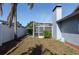 Backyard with a screened pool and a grassy area at 8134 Bayshore Dr, Seminole, FL 33776
