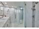 Spa-like bathroom featuring a walk-in shower with marble tile at 8134 Bayshore Dr, Seminole, FL 33776