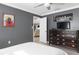 Bright bedroom with a dresser and a view into another room at 8134 Bayshore Dr, Seminole, FL 33776