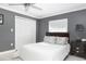 Cozy bedroom with neutral walls, ample natural light, and closet at 8134 Bayshore Dr, Seminole, FL 33776