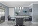 Stylish dining room with modern lighting, sleek table, and contemporary decor at 8134 Bayshore Dr, Seminole, FL 33776