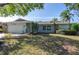 Single story home with a nicely landscaped lawn at 8134 Bayshore Dr, Seminole, FL 33776