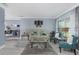 Spacious living room with sleek tile floors, comfortable seating, and stylish decor at 8134 Bayshore Dr, Seminole, FL 33776
