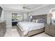 Main bedroom with sliding glass doors leading to the pool at 8134 Bayshore Dr, Seminole, FL 33776